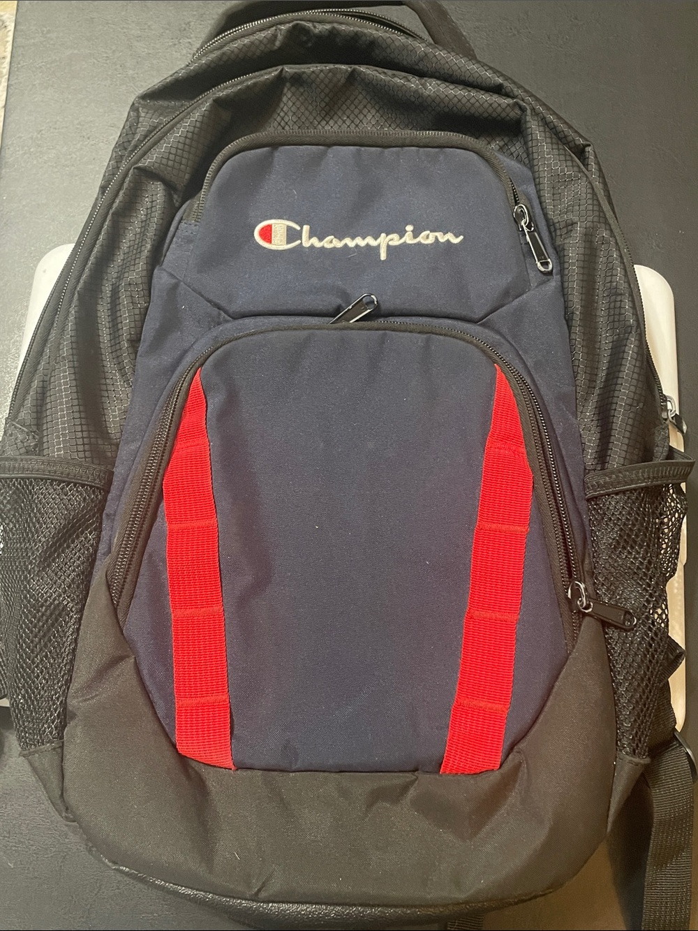 Champion Navy and Red gently used  Backpack w Logo lots of storage